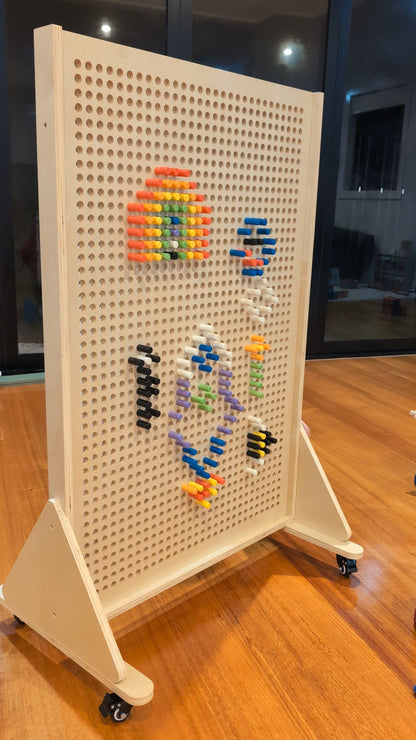 JSTEM 120 pegboard wall system on lockable castors standing on a wooden floor