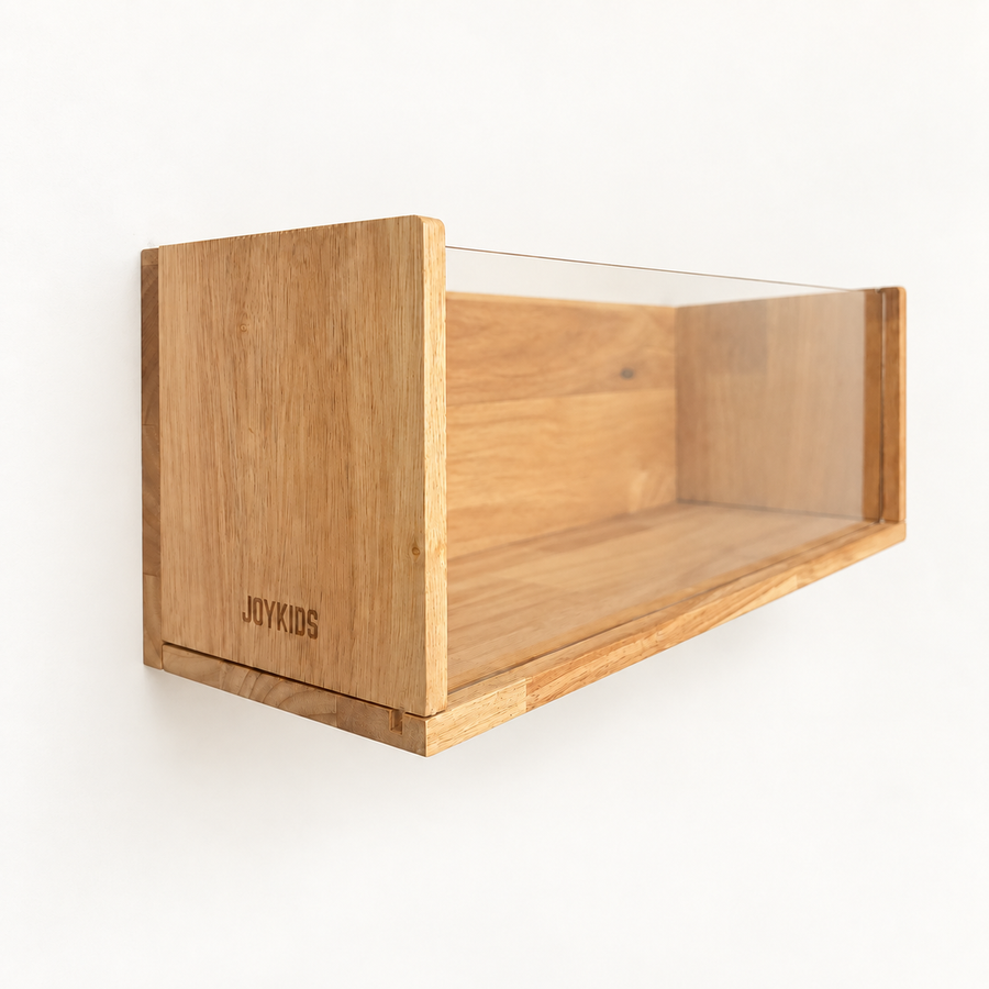 The JBOX wood-framed acrylic storage box mounted on a wall, empty, seen from the side so the clear front and the open top are both visible