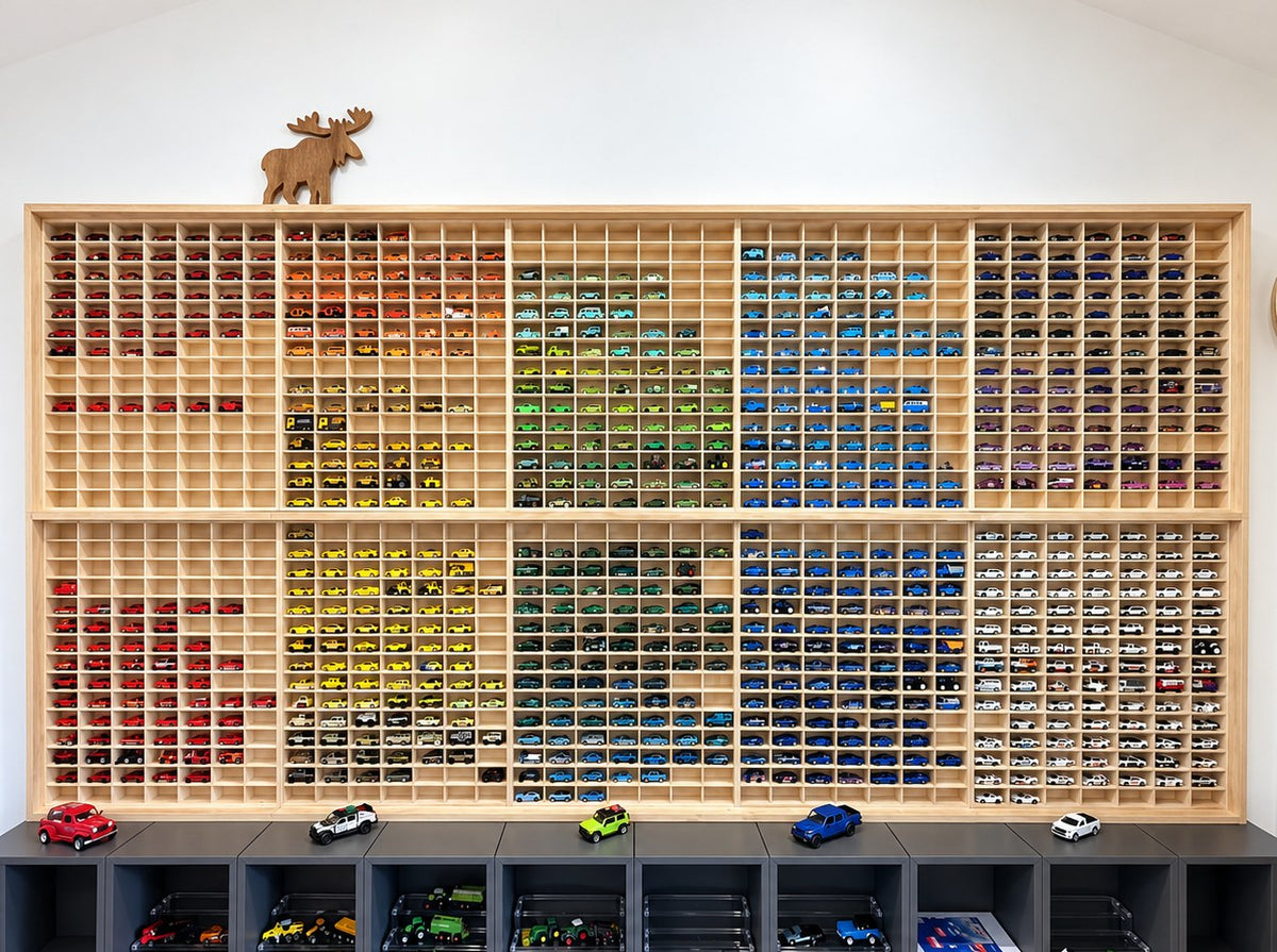 Ten JCAR 105 display racks filling one wall, holding around 1,050 diecast cars sorted by colour.