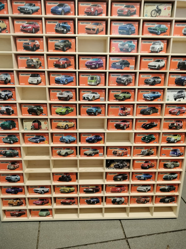 JCAR 105 holding boxed Matchbox cars, one carton to a slot