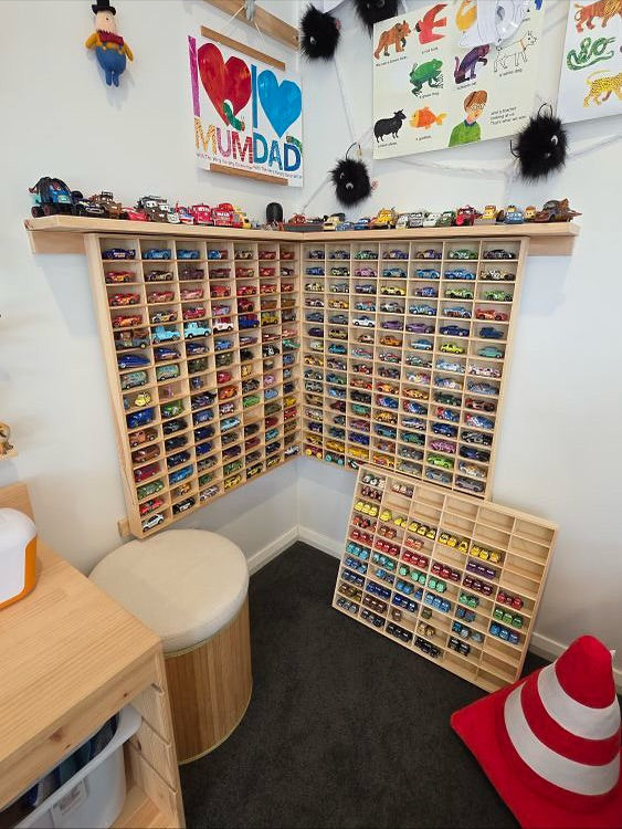 Two JCAR 105 racks meeting in the corner of a child's room, a third leaning below